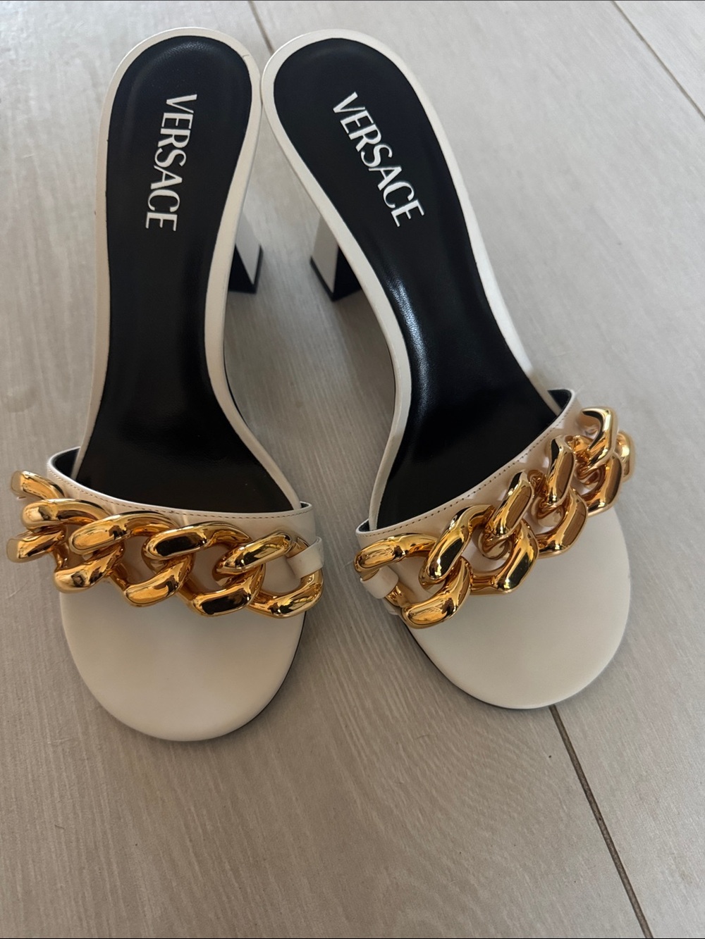Versace White Slide Mules with Gold Chain Accent